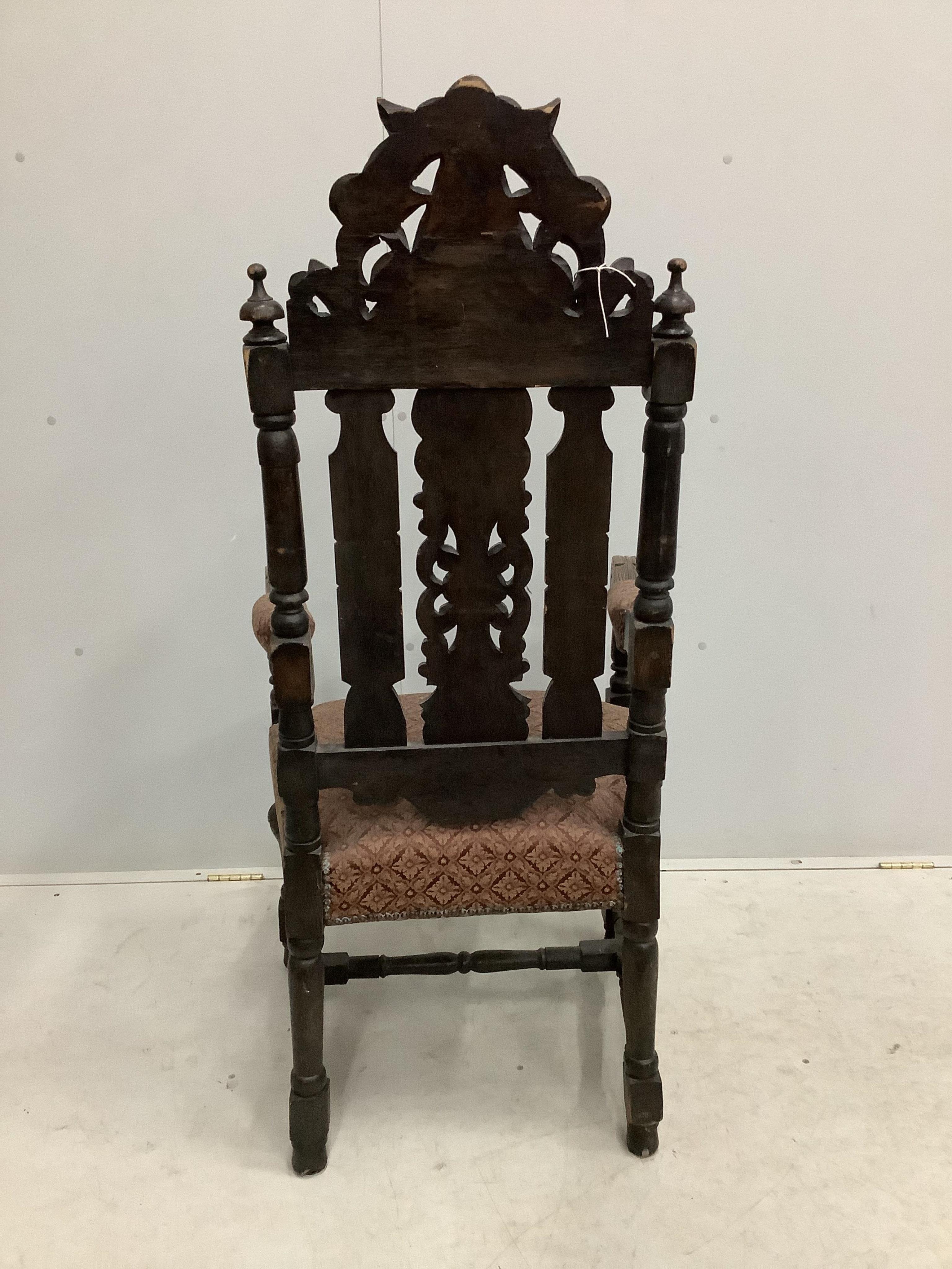 A set of thirteen carved Victorian oak dining chairs, one with arms. Condition - poor to fair